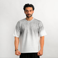 Man wearing a plain white t-shirt against a light gray background