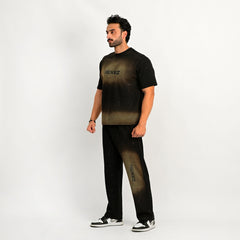 Man wearing a black t-shirt and pants with 'REXEEZ' branding on a white background