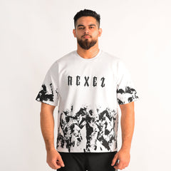 Man wearing a white t-shirt with black abstract patterns and 'REXEZ' branding on a plain background