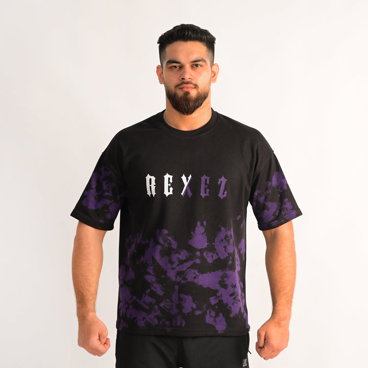 Man wearing a black t-shirt with purple camouflage patterns and 'REX EZ' text on a white background