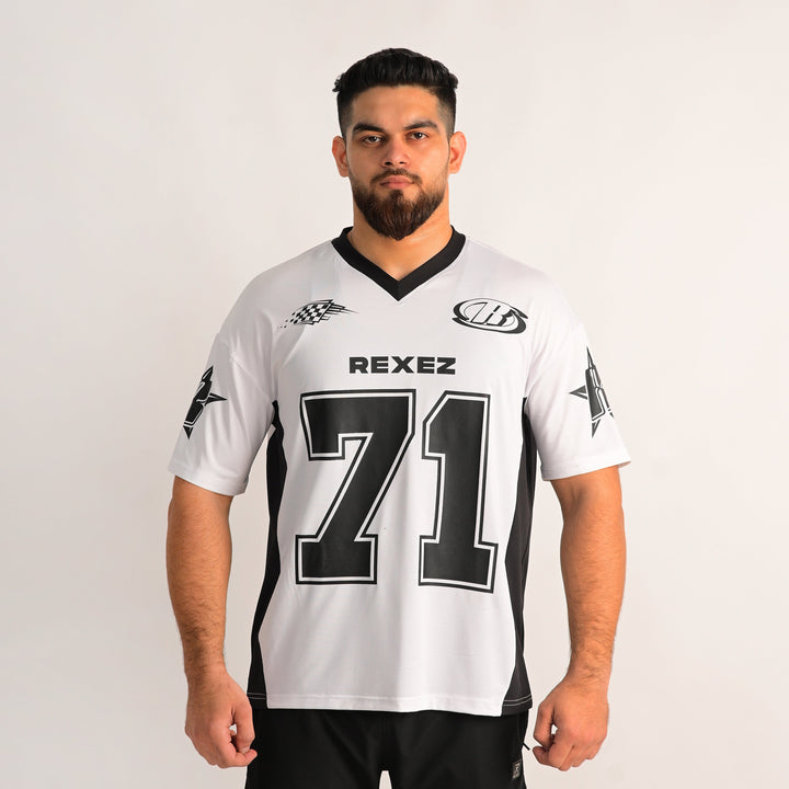 A man modeling a white and black athletic jersey with 'REXEZ' and the number '71' printed on the front, set against a plain light gray background.